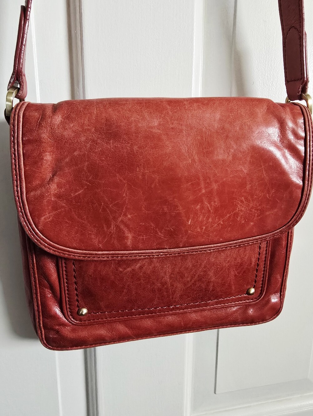 Cole Haan red soft leather distressed cross body bag